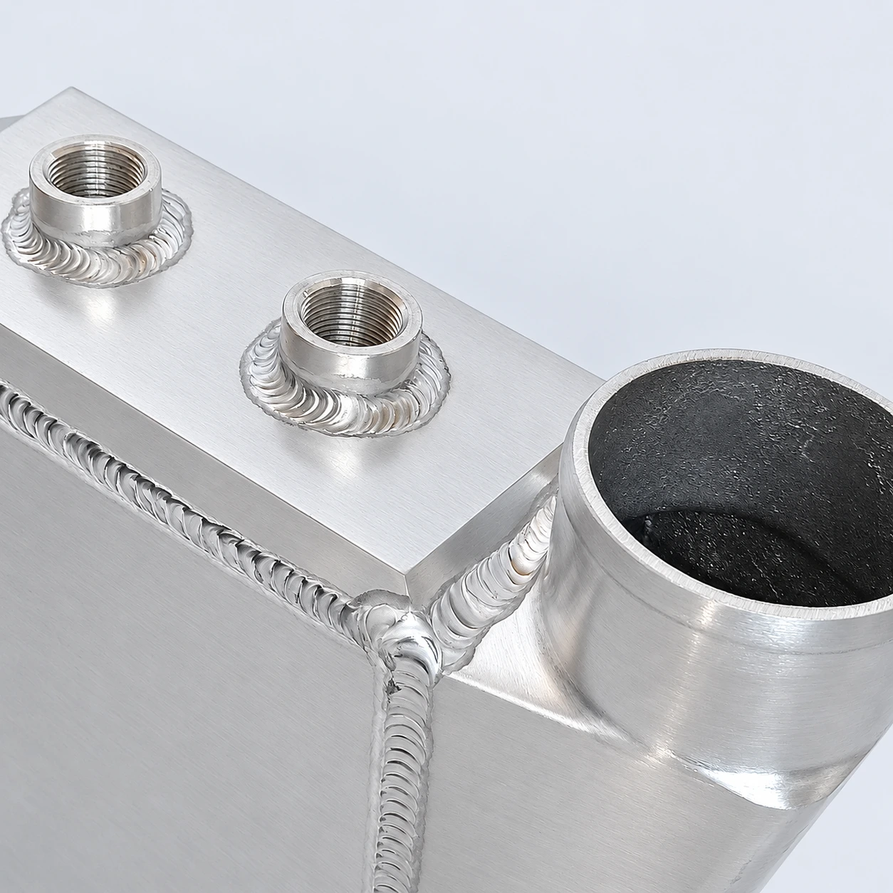 AWIC005-A close-up · Threaded coolant connections and welds
