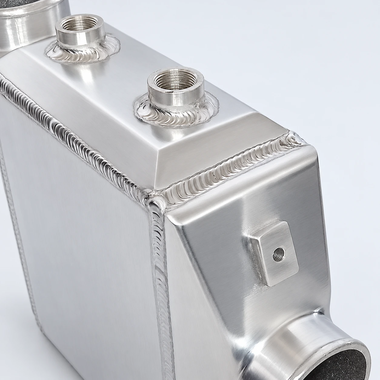 AWIC006-B close-up · Threaded coolant connections and welds