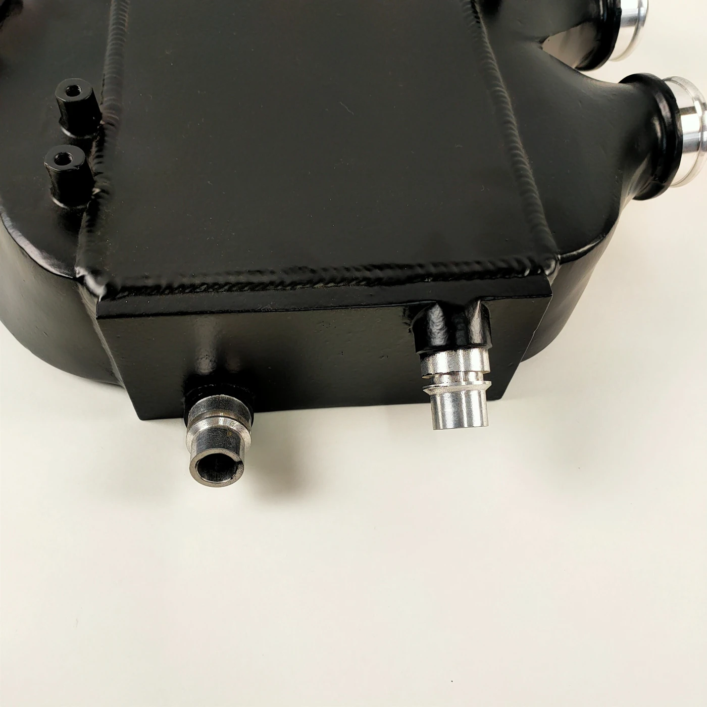 Coolant connections and welded housing