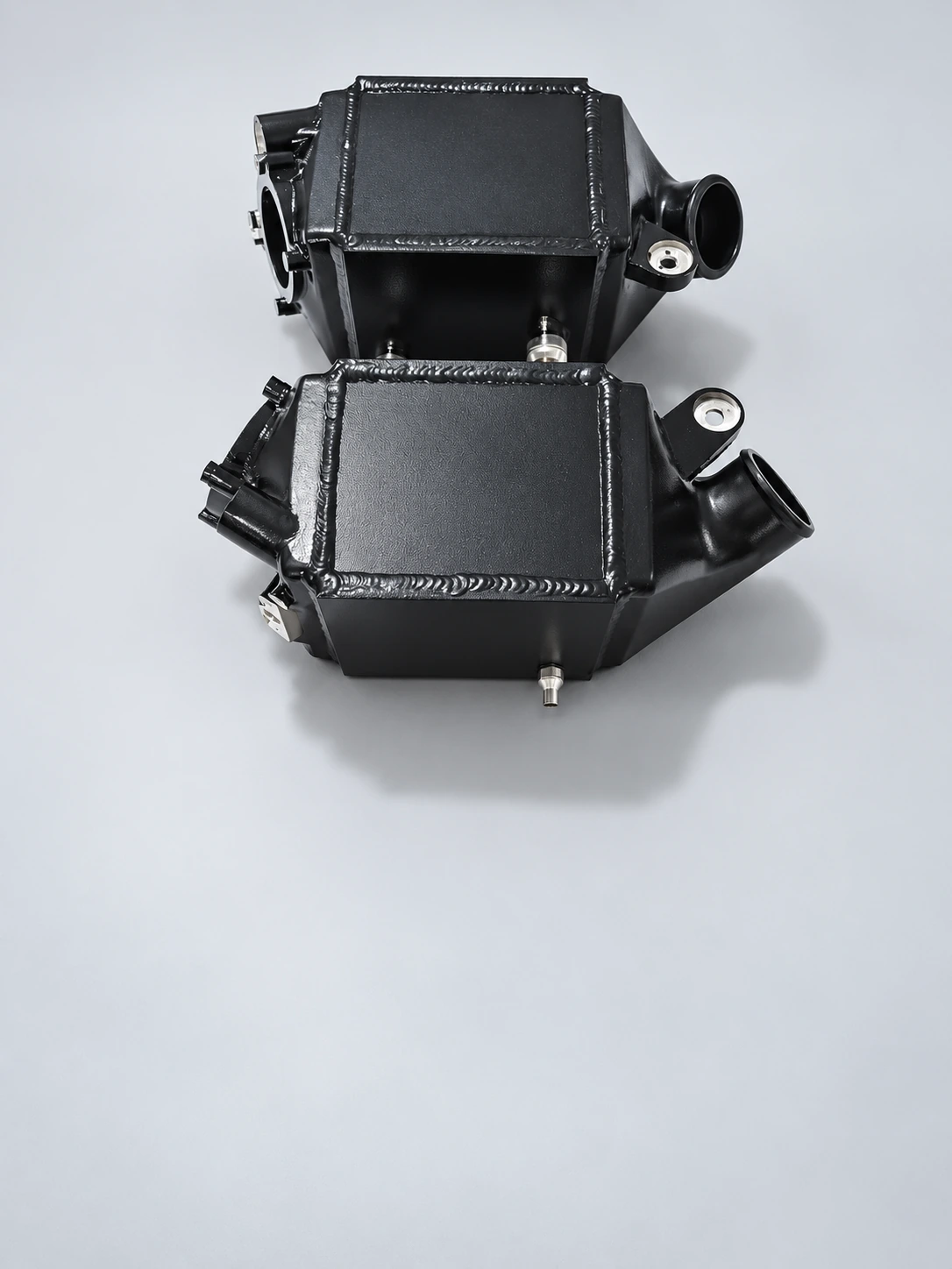 BMW M5/M6 Angled view — housings, ports and mounting eyes