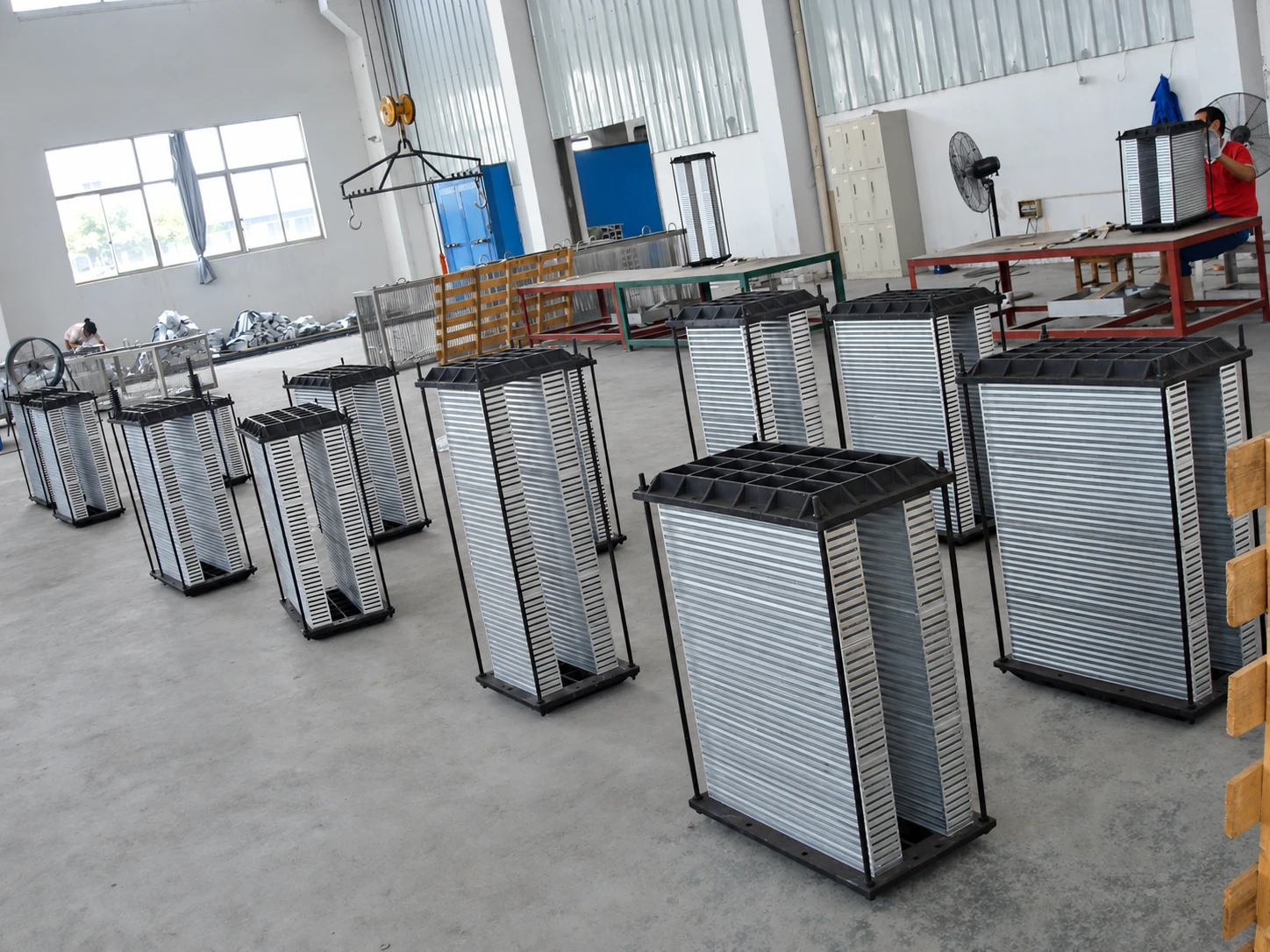 Bar-and-Plate intercooler core assemblies staged in the workshop.