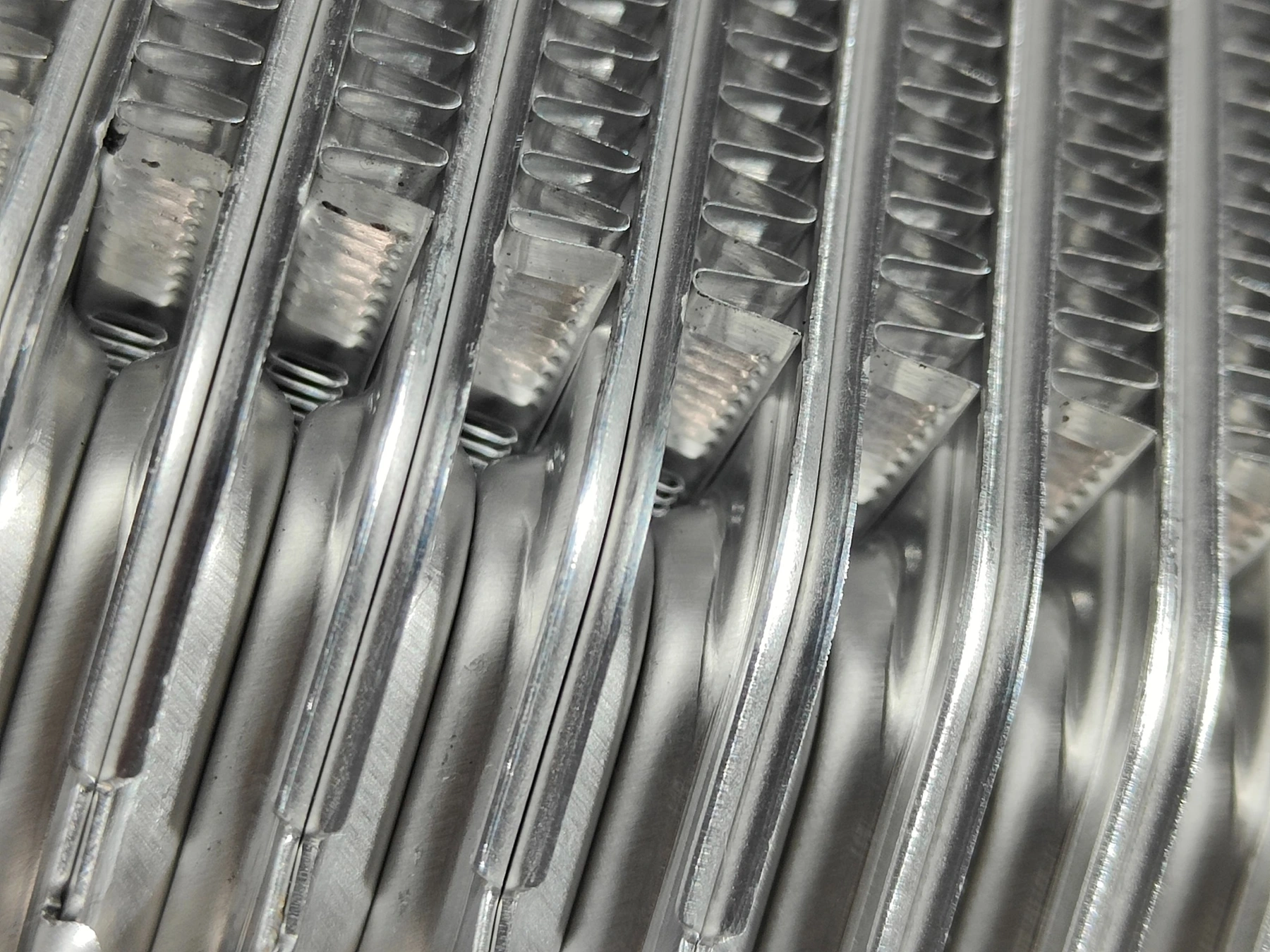 Oil cooler fins and louver cuts before brazing, close-up