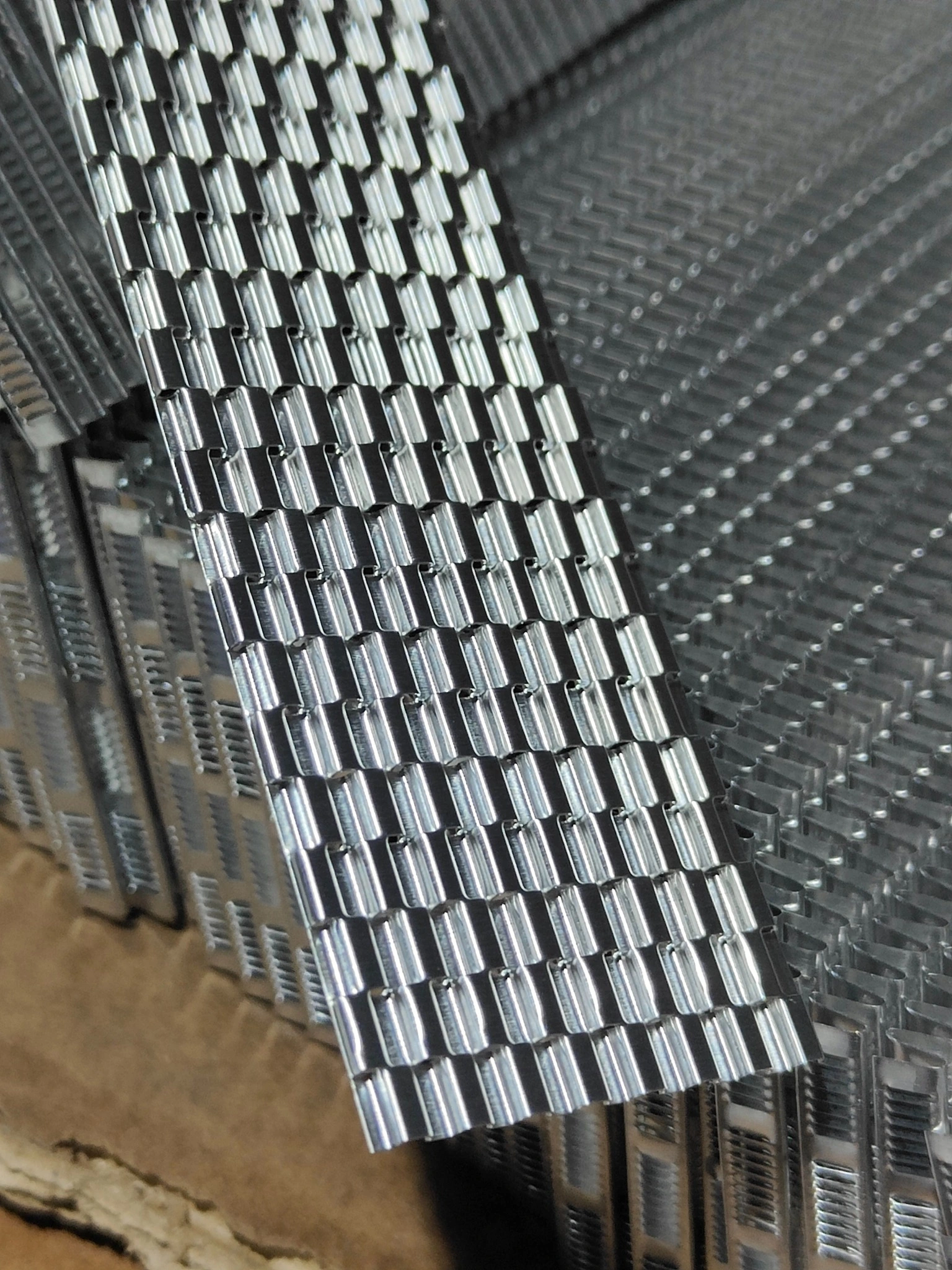 Manufacturer photograph of the internal oil-passage fin before it is enclosed inside the brazed cooler